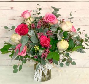 pink and red Romantic shades of roses, coupled with eucalyptus greenery and wildflower accents,