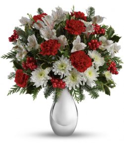 festive array of crimson carnations and winter white alstroemeria and holly berries.