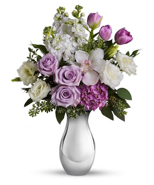 lush lavender roses, white orchid and other fabulous favorites in a Silver Reflections vase.