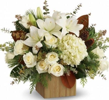 a chic bamboo cube, this extraordinary bouquet of snowy-white blooms and fresh greens is a modern winter gift.