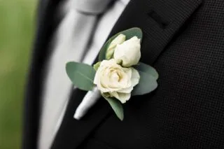 Close-up,Of,A,Boutonniere,Pinned,A,White,Rose,At,A